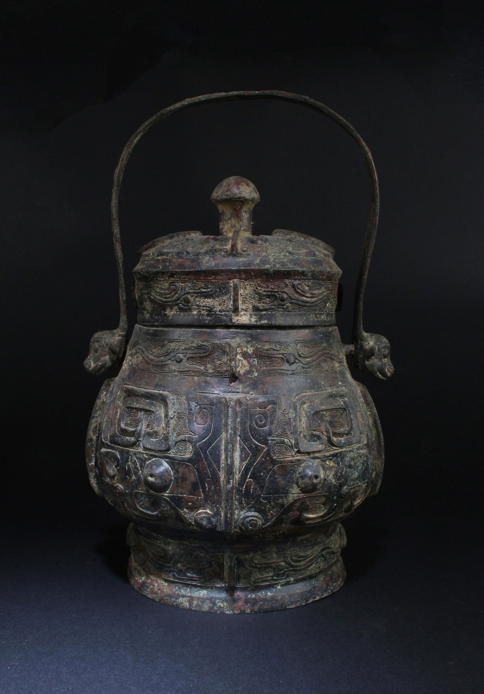 A Bronze Archaic Container: A Bronze Archaic Container. Height: 11" Diameter: 8.5"