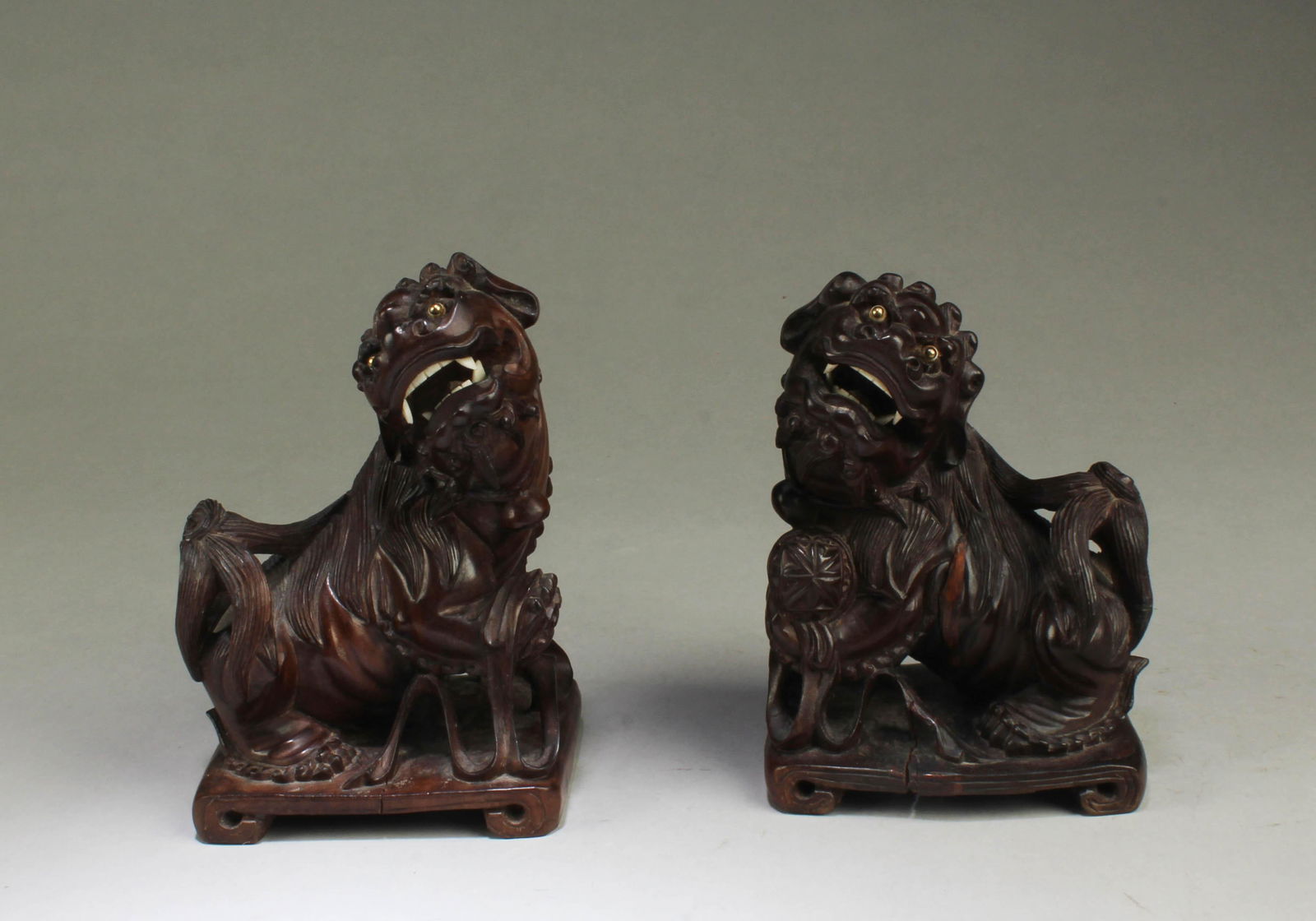 A Pair of Carved Wooden Mythical Beast Figurines: A Pair of Carved Wooden Mythical Beast Figurines Height: 6.25"