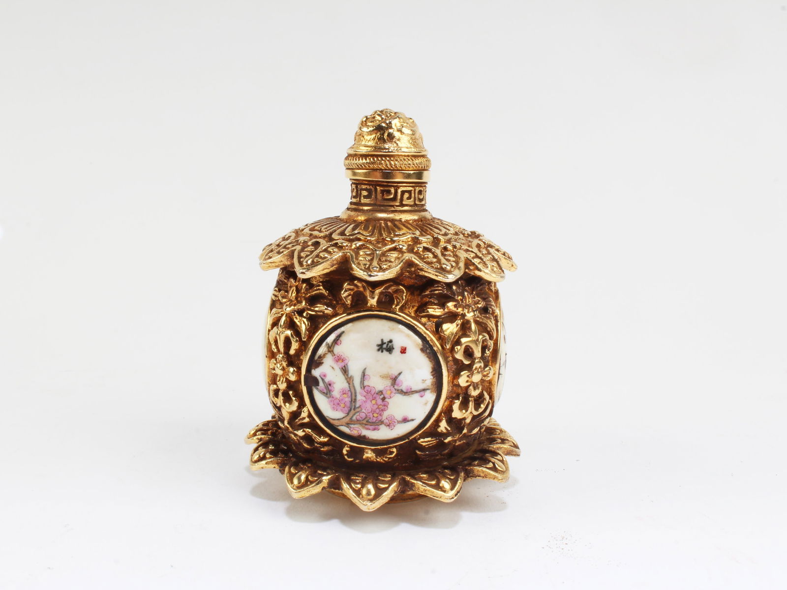 A Gilt Bronze Enamel Snuff Bottle: A Gilt Bronze Enamel Snuff Bottle. 'QianLong' mark. Height: 2.5"