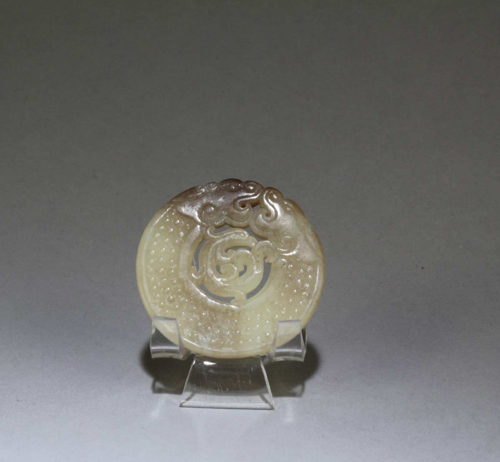 A Chinese Jade Ornament: A Chinese Jade Ornament. Dimensions: 2" x 2".