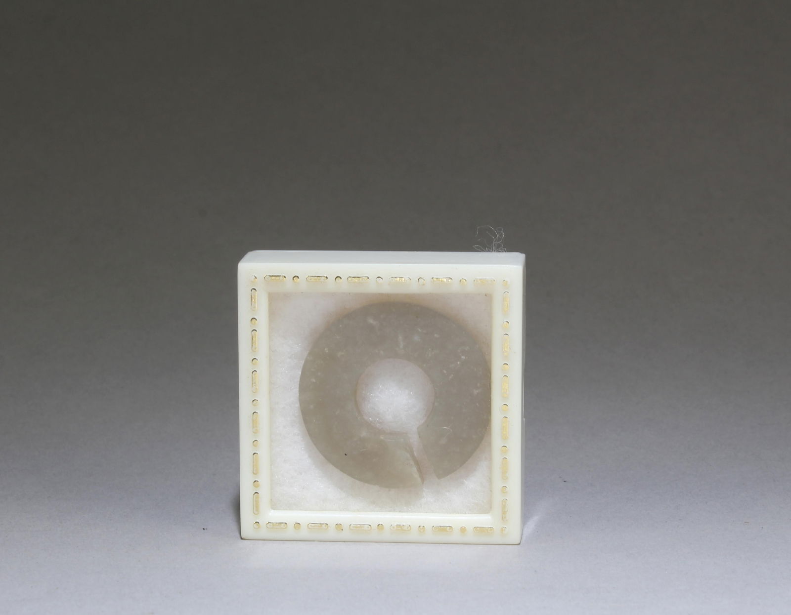 A Chinese Antique Jade Nose Ring: A Chinese Antique Jade Nose Ring. Dimensions: 1.15" x 1.15".