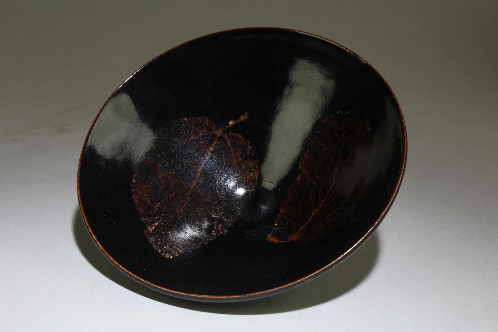 A Chinese JiZhou Tea Bowl: A Chinese JiZhou Tea Bowl. Dimensions: 2" x 5.9".