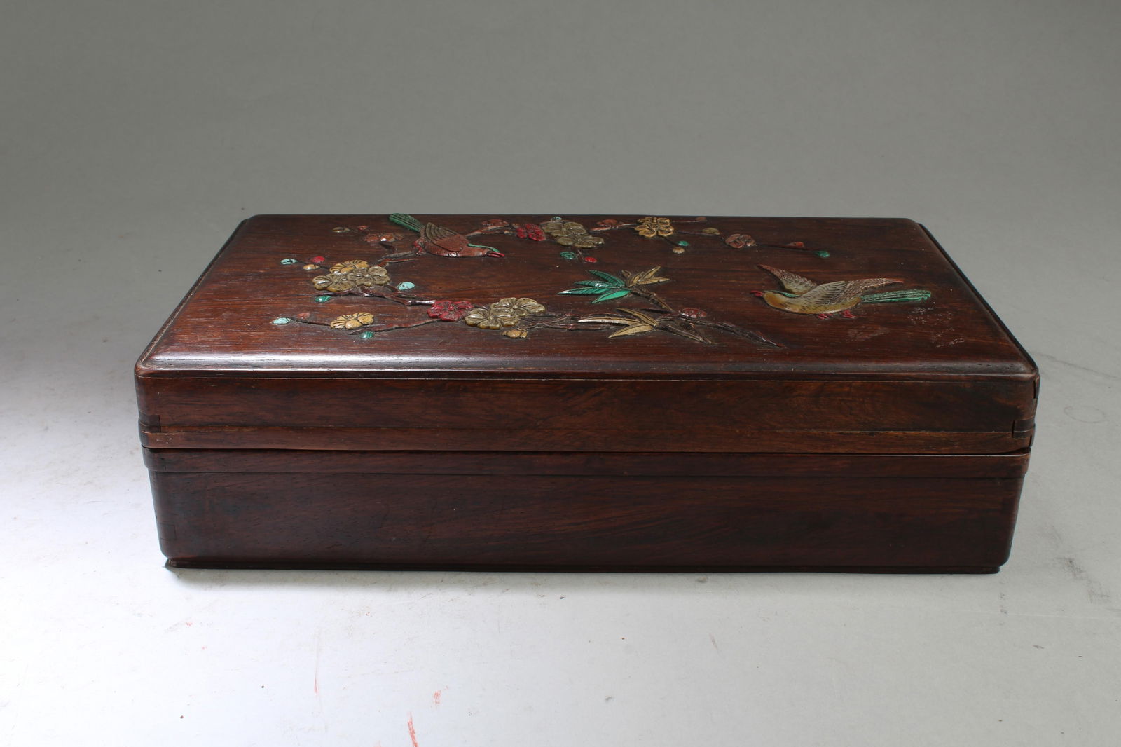 A Rosewood Box with Mother Pearl Inlay: A Rosewood Box with Mother Pearl inlay. Length: 11" Width: 6.25" Height: 2.75"