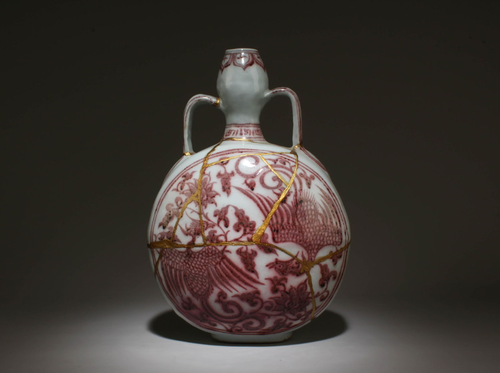 An Underglazed Red Moonflask Vase: An Underglazed Red Moonflask Vase. Dimensions: 12" x 8".