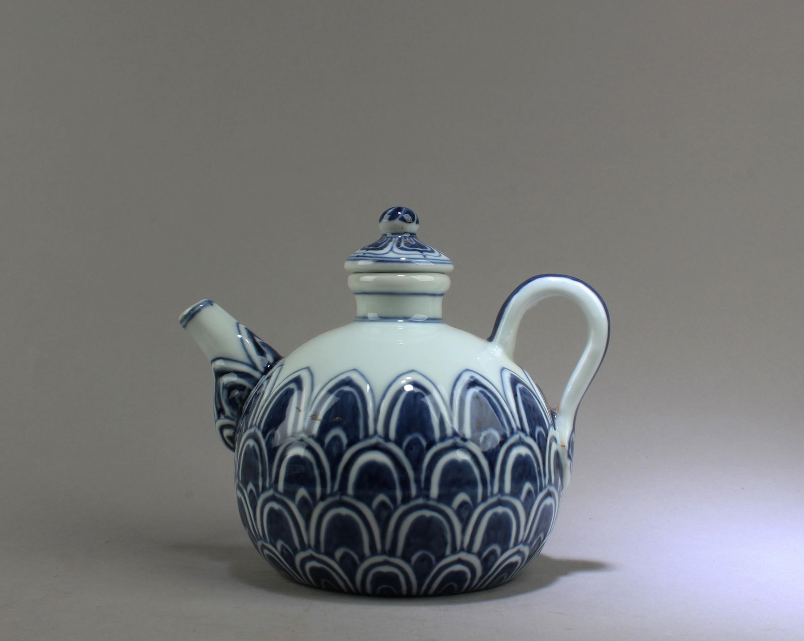 Chinese Blue & White Porcelain Teapot: Chinese Blue & White Porcelain Teapot. 'XuanDe' mark. Height: 5.5" Length: 6.75"