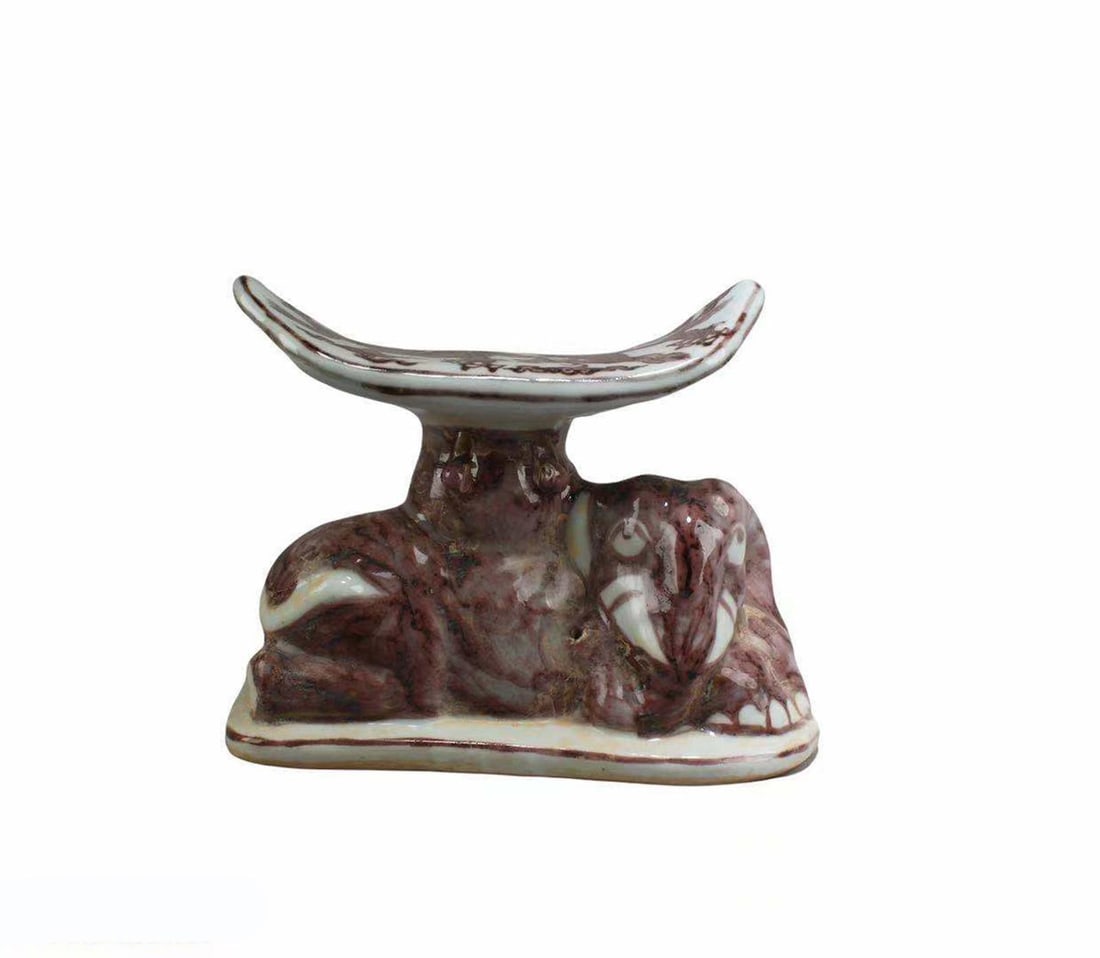 Chinese Iron Red Porcelain Pillow: Chinese Iron Red Porcelain Pillow. 'XuanDe' mark. Height: 6.25" Length: 7.5" Width: 4"