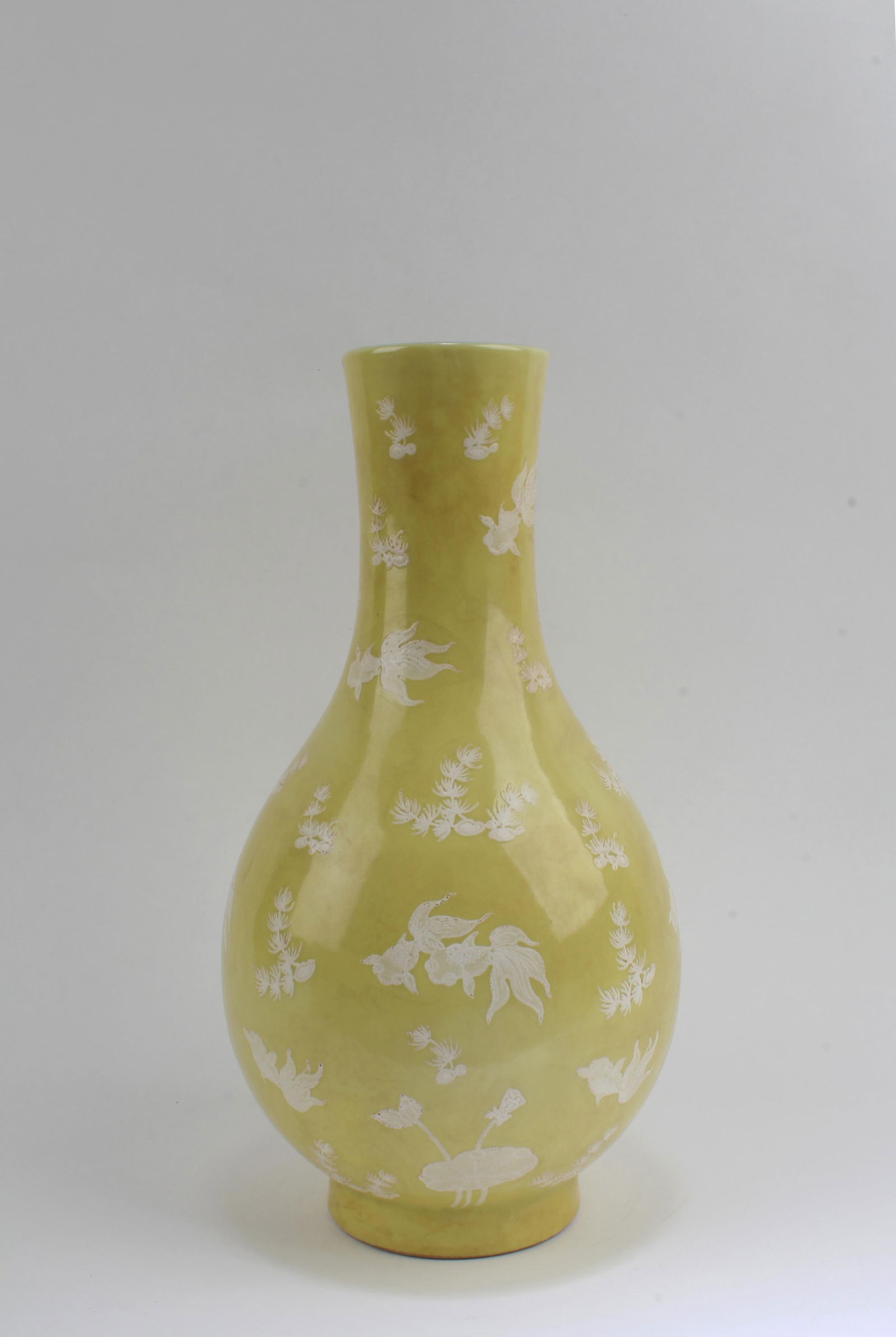 Chinese Yellow Color Porcelain Vase: Chinese Yellow Color Porcelain Vase. 'QianLong' mark at base. Height: 9.9"