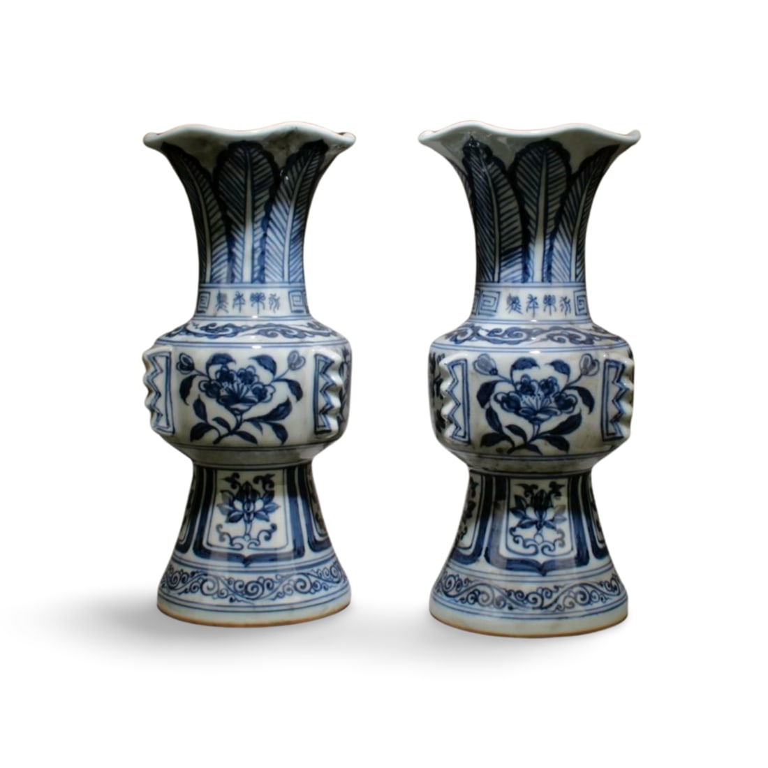 A Pair of Blue and White Vases: A Pair of Blue and White Vases. Dimensions: 10" x 5".