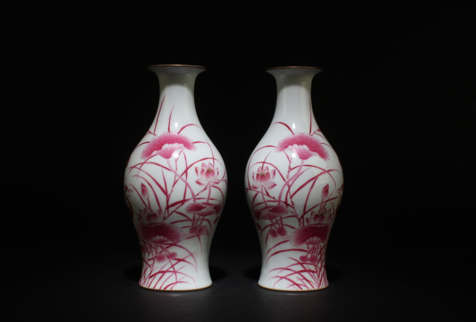 A Pair of Red glazed Porcelain Vases: A Pair of Red glazed Porcelain Vases. Dimensions: 9.5" x 4.2".