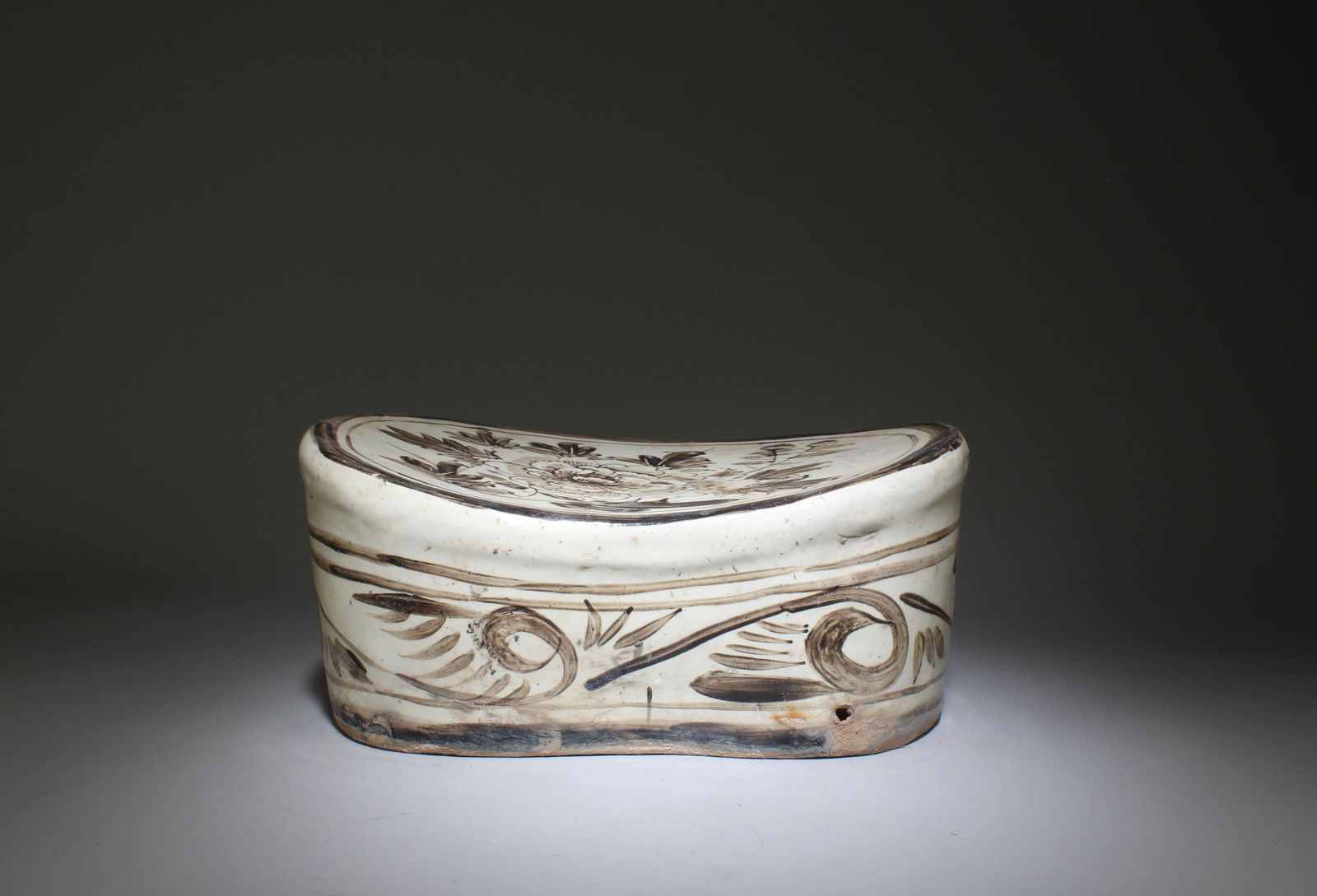 A Cizhou Pillow: A Cizhou Pillow. Dimensions: 11" x 8" x 5".