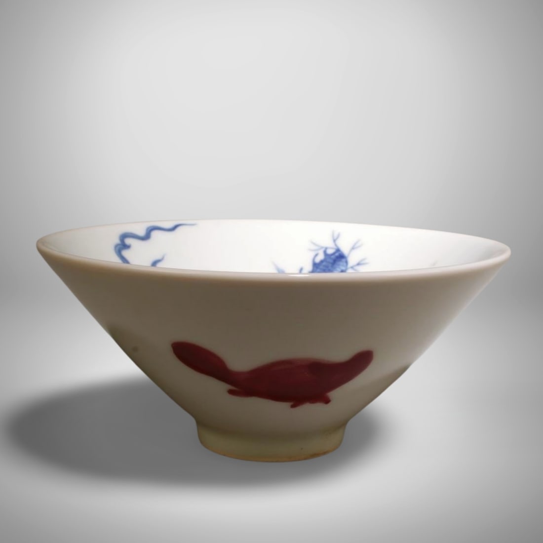 A Blue and Red Bowl: A Blue and Red Bowl. Dimension: 5.75" x 2.5".