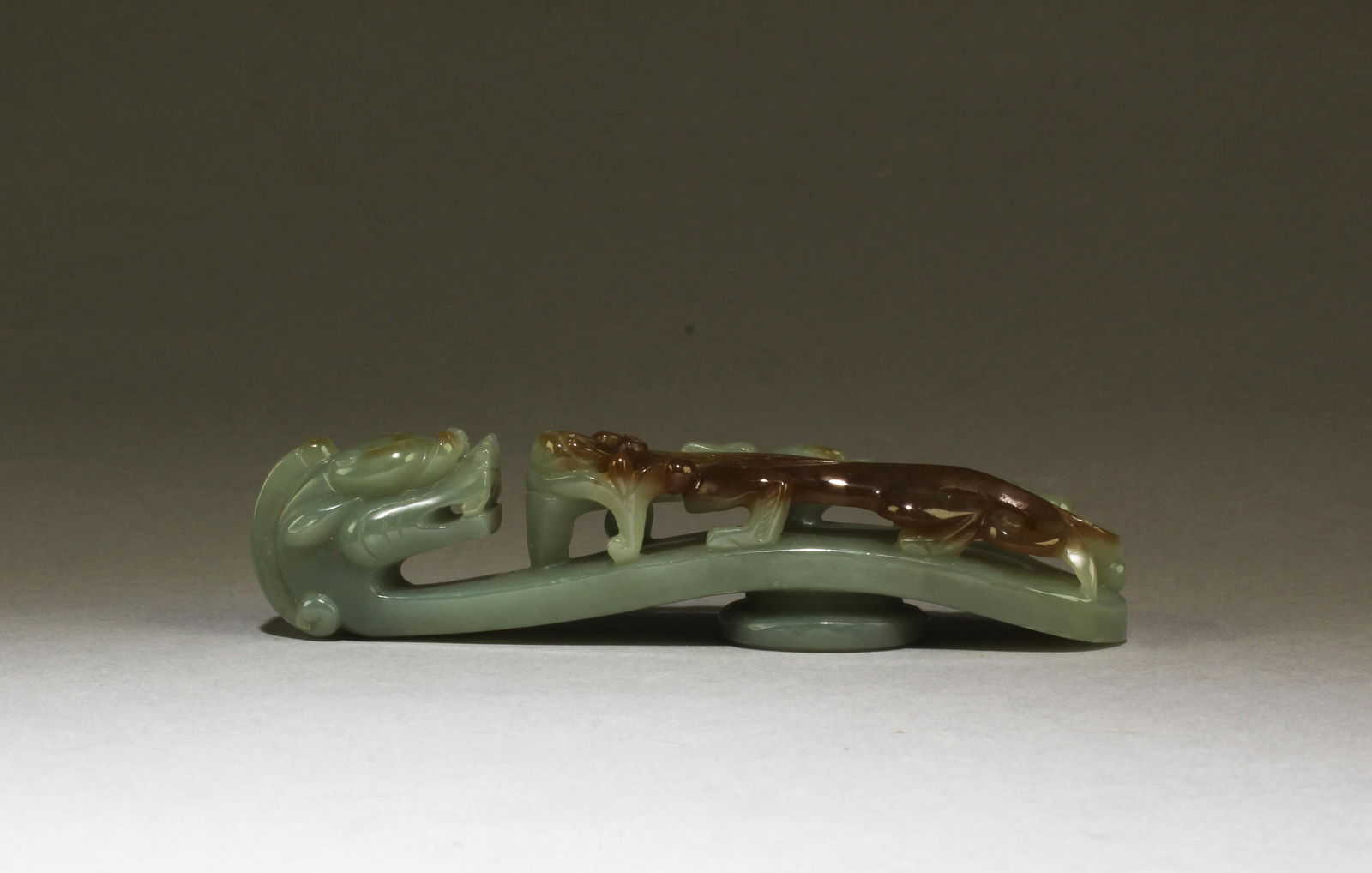 Chinese Jade Belt Hook: Chinese Jade Belt Hook with russet suffusions.. Length: 5"