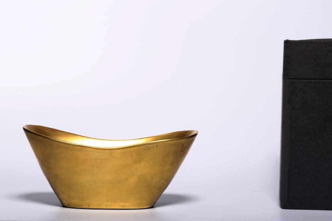 A Gilt Boat?Shaped Ingot: A Gilt Boat?Shaped Ingot. Dimensions: 3.78" x 1.89" x 1.69"; Weight: 0.179lbs.