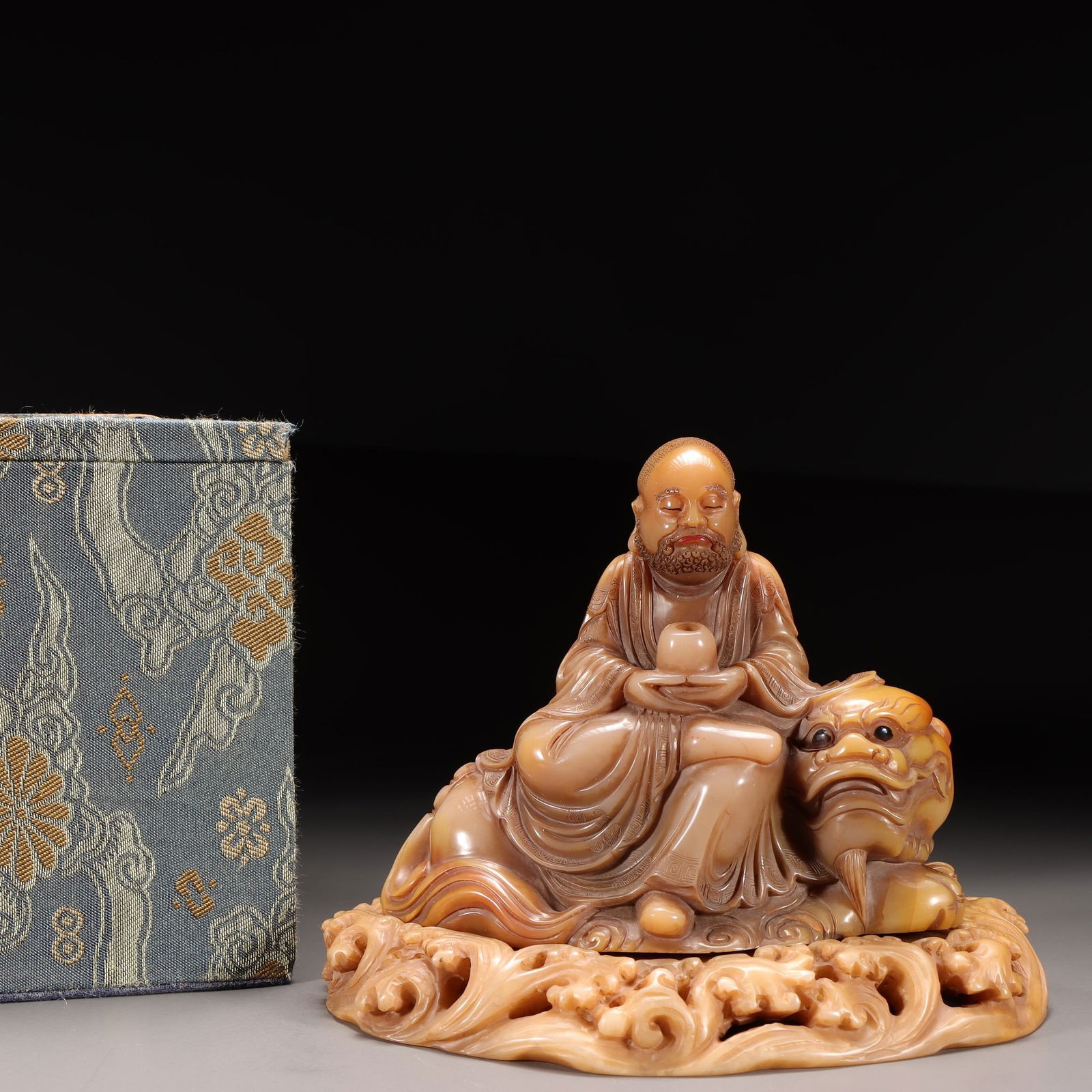 A Shoushan Stone Seated Arhat Statue: A Shoushan Stone Seated Arhat Statue. Dimensions: 4.45" x 5.71" x 3.94"; Weight: 1.76lbs.