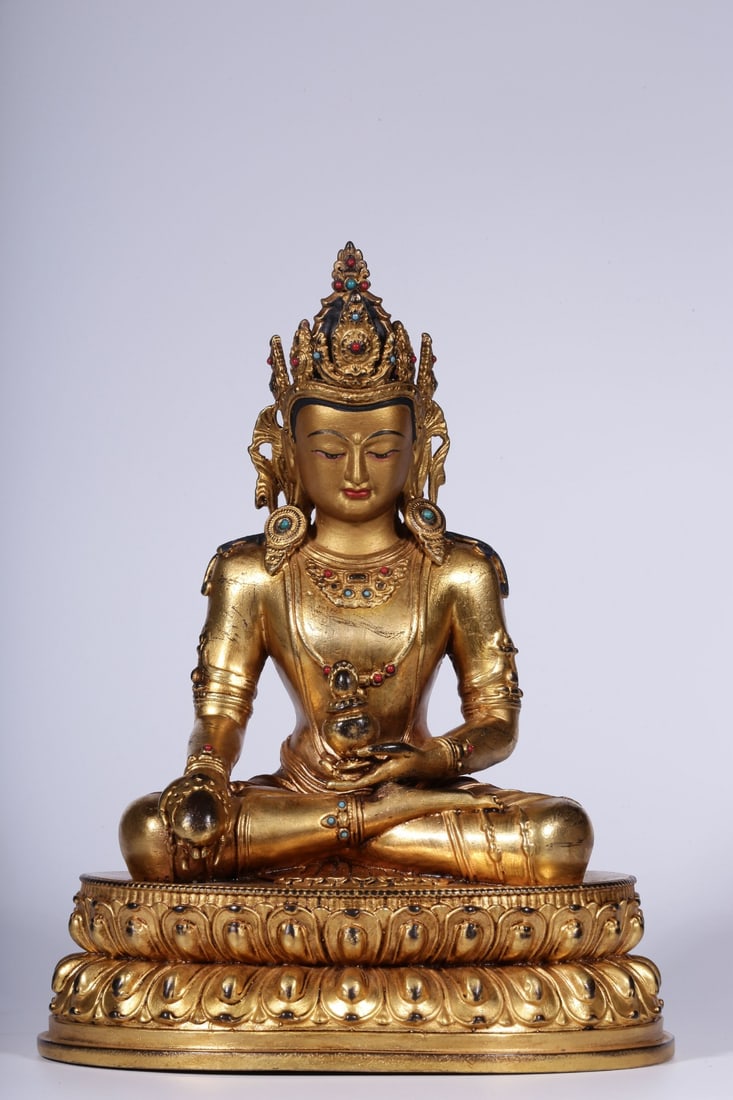 A Gilt Bronze Inlaid Longevity Buddha Statue: A Gilt Bronze Inlaid Longevity Buddha Statue. Dimensions: 8.27" x 6.18" x 4.84"; Weight: 3.206lbs.