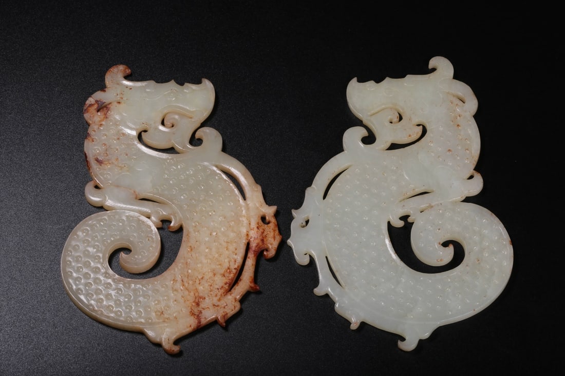 A Pair of Hetian White Jade Dragon Bi: A Pair of Hetian White Jade Dragon Bi. Dimensions: 5.91" x 3.82" x 0.16"; Weight: 0.419lbs.