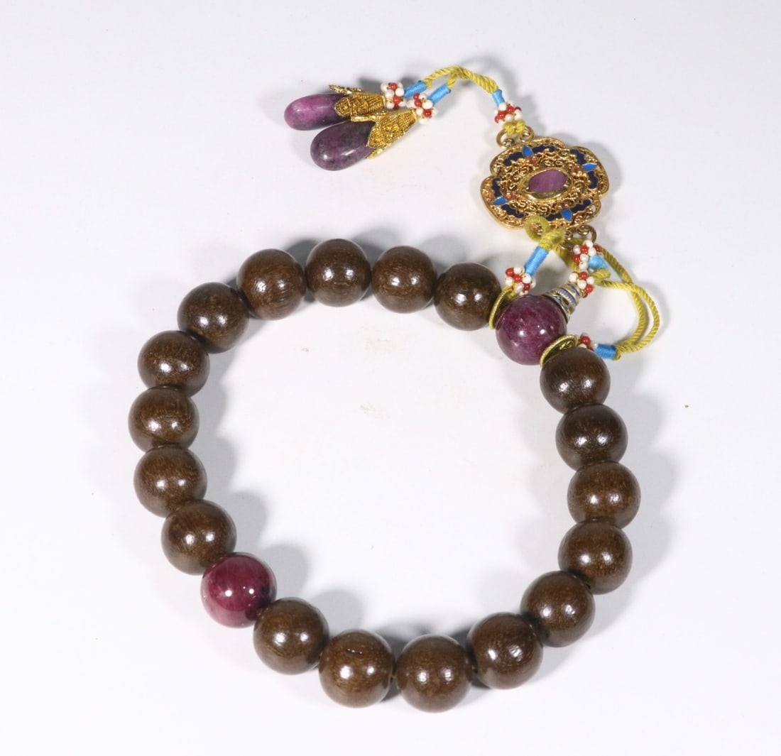 A Prayer Bead Strand with Agarwood and Crystal Spacers: A Prayer Bead Strand with Agarwood and Crystal Spacers. Diameter: 0.63"; Weight: 0.199lbs.