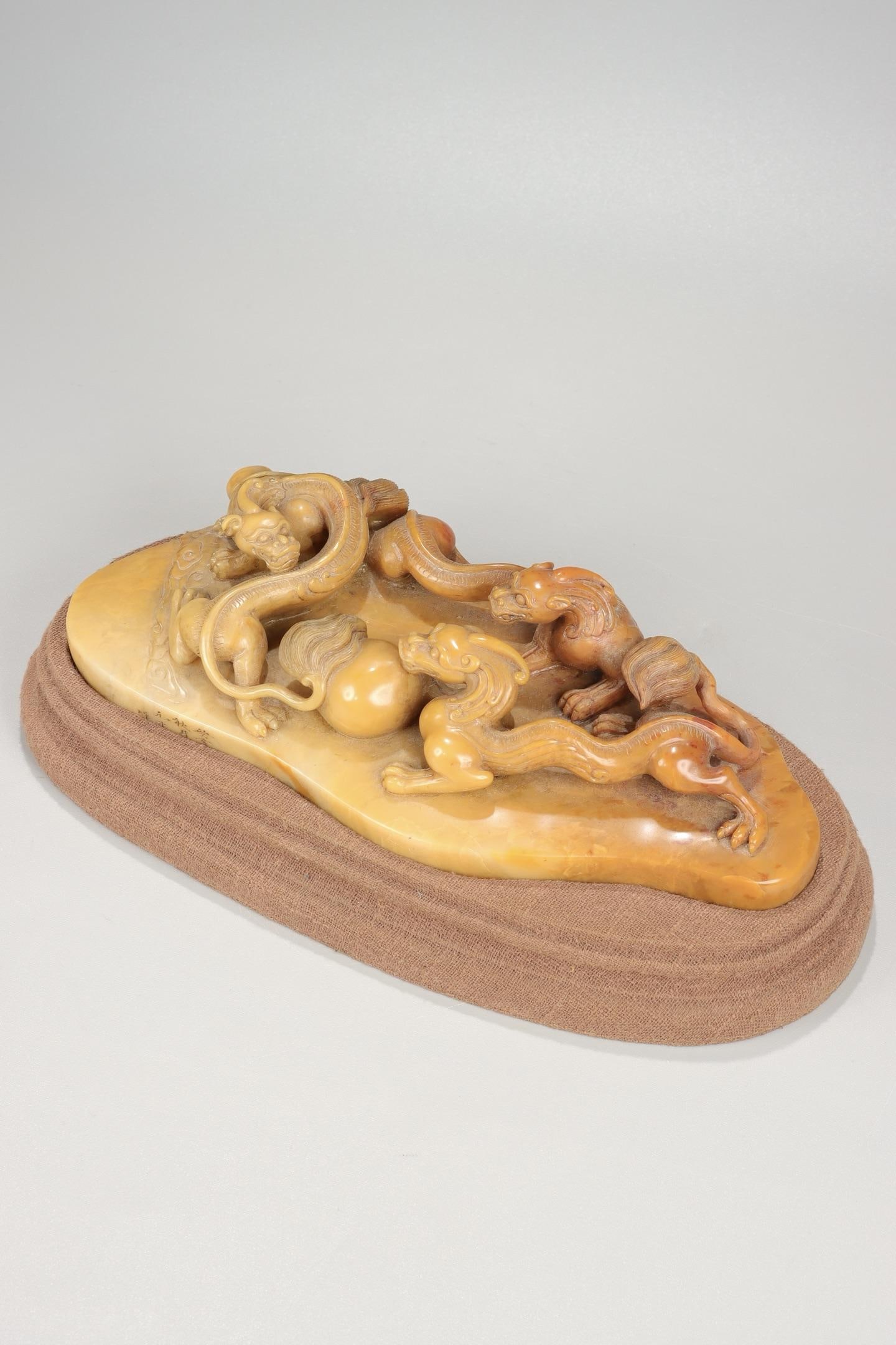 A Shoushan Stone Dragon Ornament: A Shoushan Stone Dragon Ornament. Height: 1.97"; Length: 8.46"; Width: 3.54"; Weight: 2.222lbs.