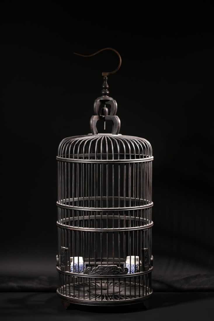 A Zitan Wood Birdcage: A Zitan Wood Birdcage. Height: 31.50"; Diameter: 11.81".