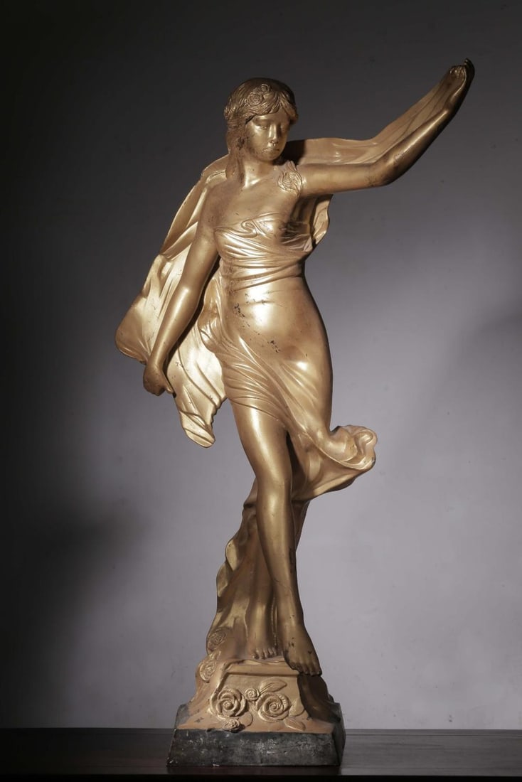 A Gilt Bronze Western Lady Statue: A Gilt Bronze Western Lady Statue. Height: 41.14"; Length: 23.23"; Width: 15.75"; Weight: 44.48lbs.