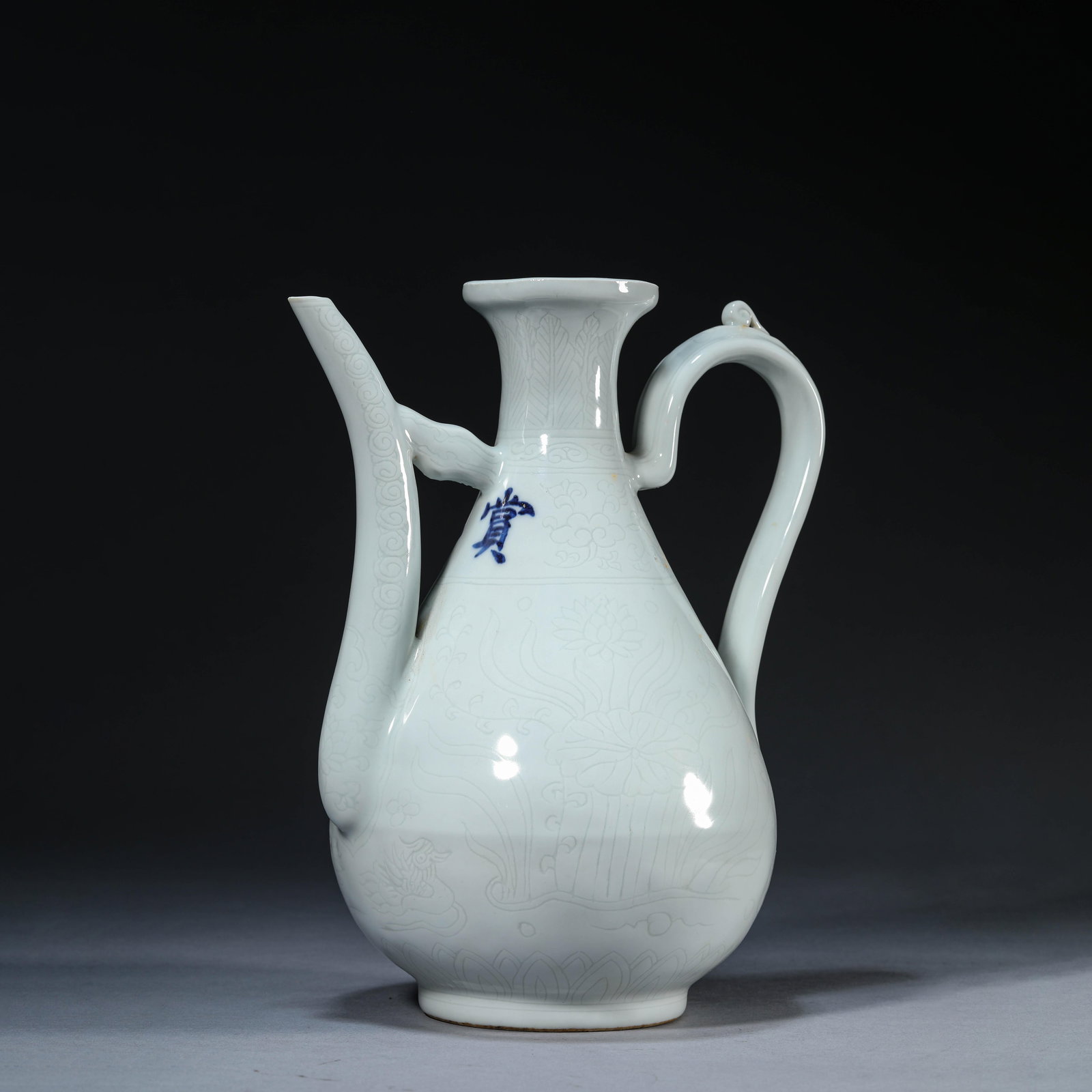 White-Glazed Incised Flower and Bird Ewer: White-Glazed Incised Flower and Bird Ewer. Height:10.24" Length:8.27" Width:6.06"