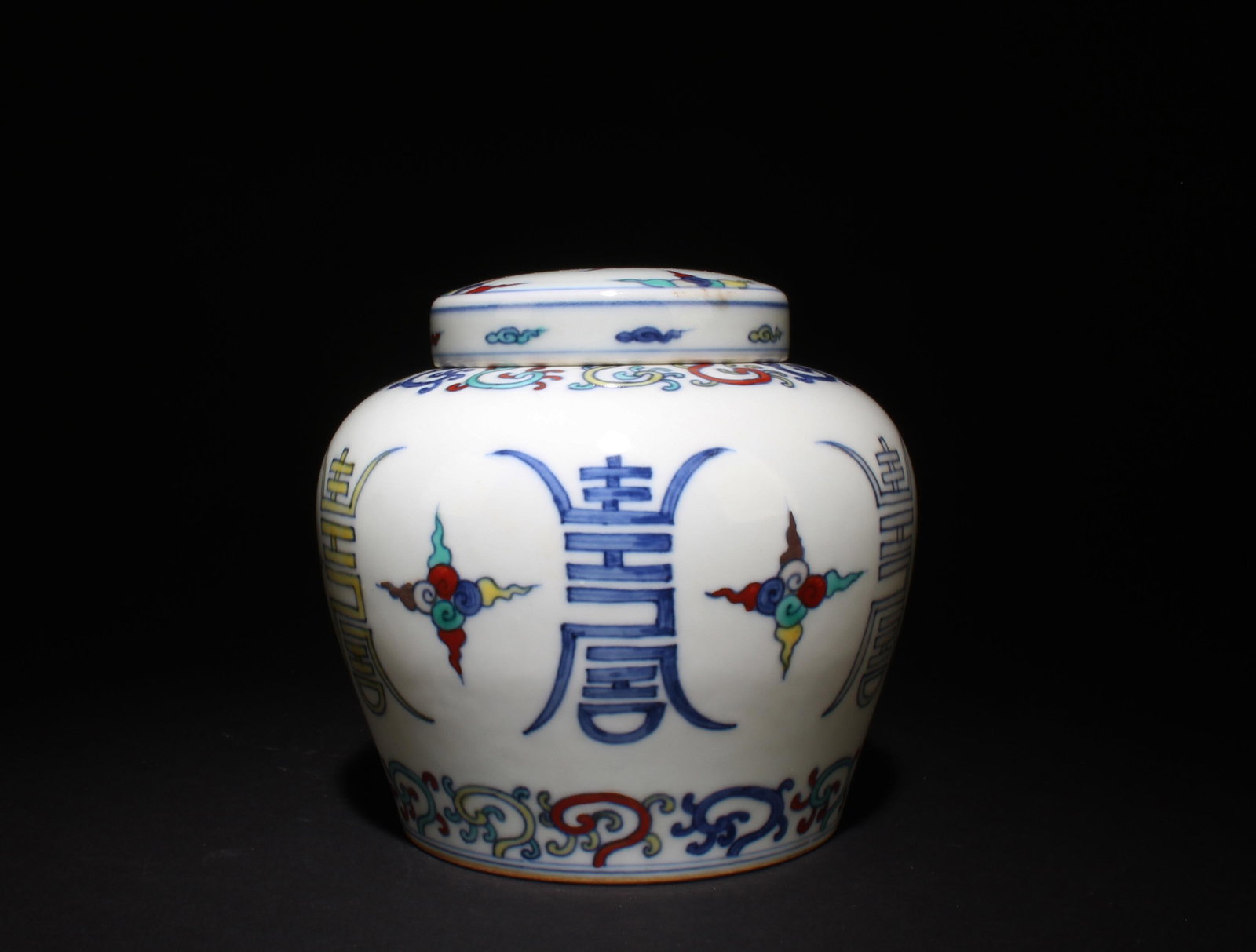 A Doucai Container with Lid: A Doucai Container with Lid. Dimensions: 5.75" x 5.25".