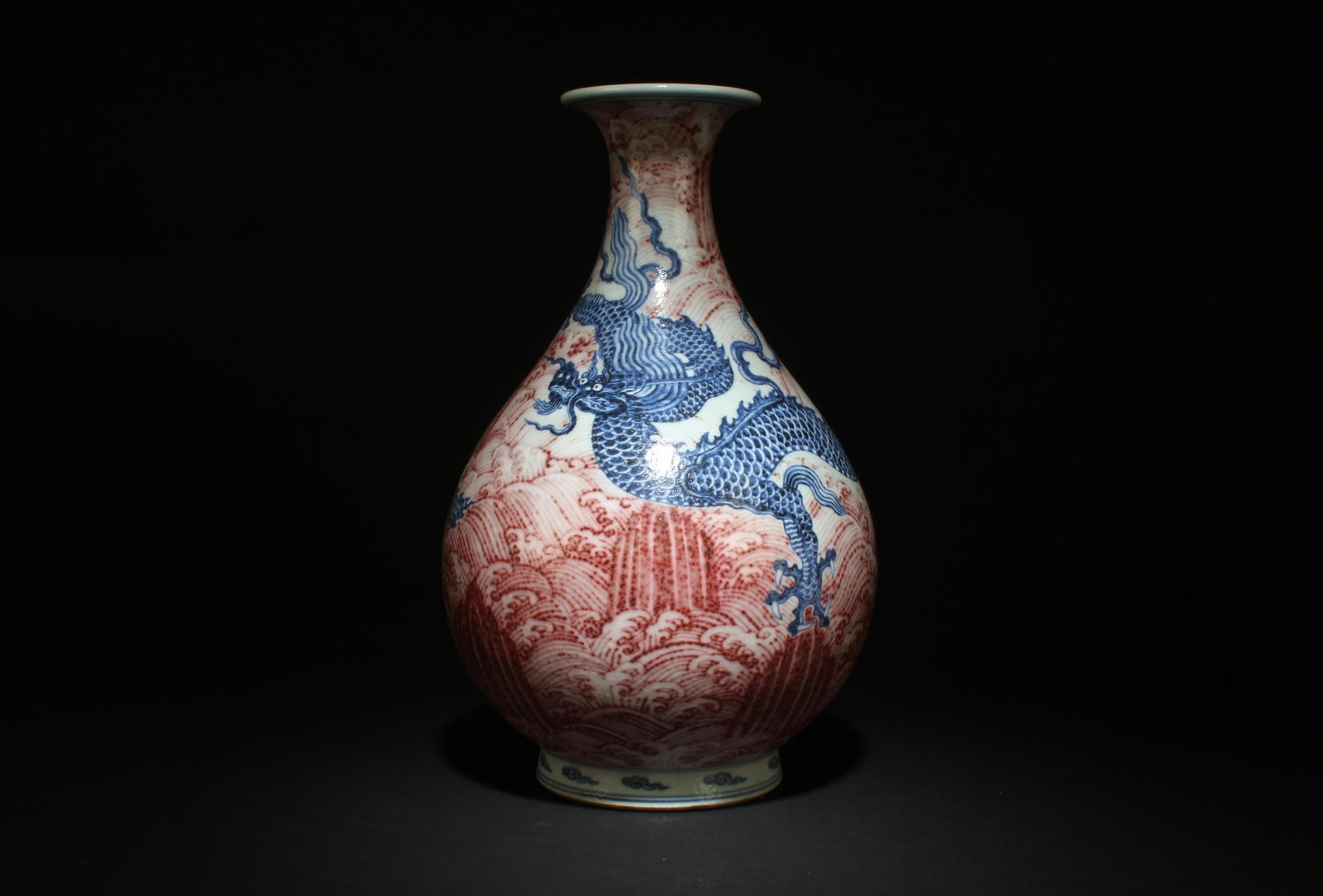 A Blue and Iron Red Yuhuchun Dragon Vase: A Blue and Iron Red Yuhuchun Dragon Vase. Dimensions: 8" x 12".