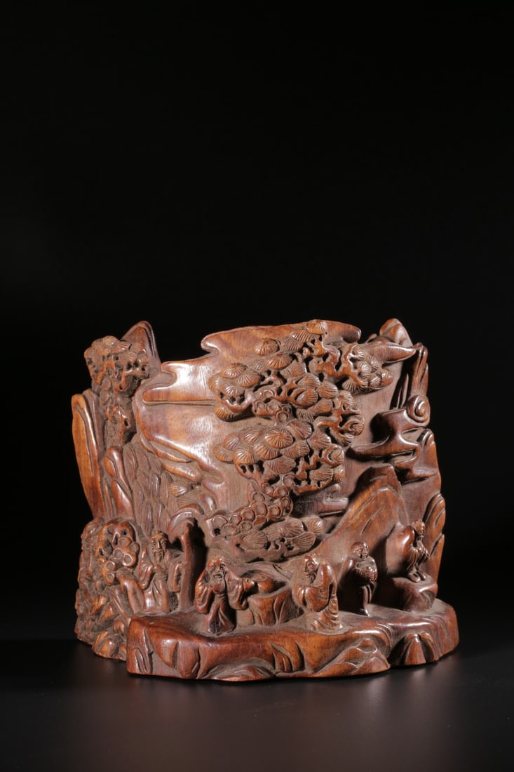 A Huanghuali Wood Carving: A Huanghuali Wood Carving. Height: 4.13" Length: 4.92" Width: 2.76" Weight: 0.74lbs.