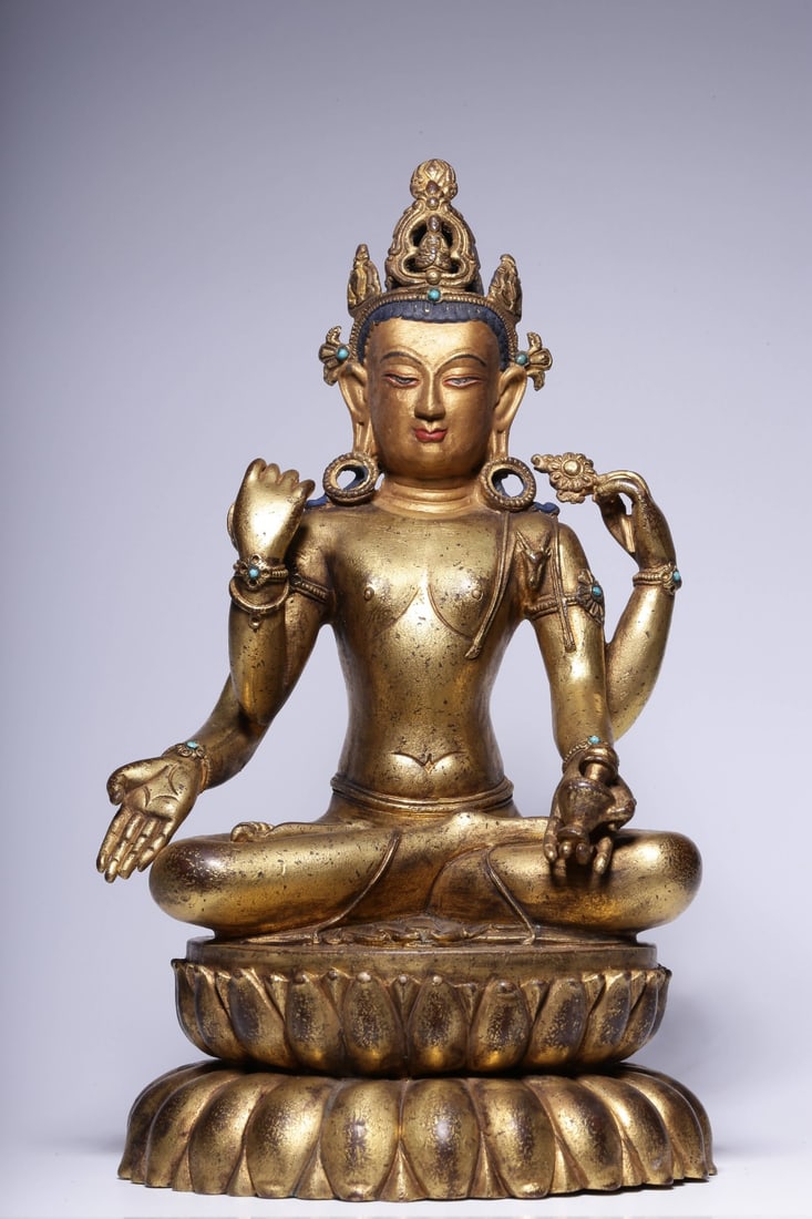 A Gilt Bronze Avalokiteshvara Statue: A Gilt Bronze Avalokiteshvara Statue. Height: 9.45" Length: 5.31" Width: 4.92" Weight: 5.1lbs.