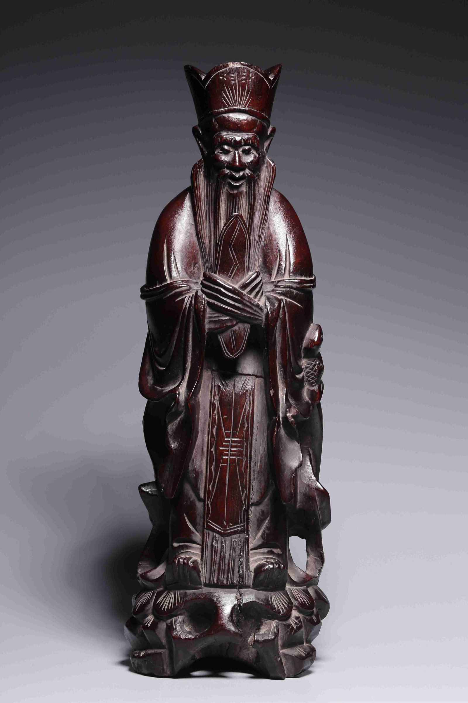 A Hardwood Figure Carving: A Hardwood Figure Carving. Height: 12.01" Length: 4.13" Width: 3.31" Weight: 1.88lbs.