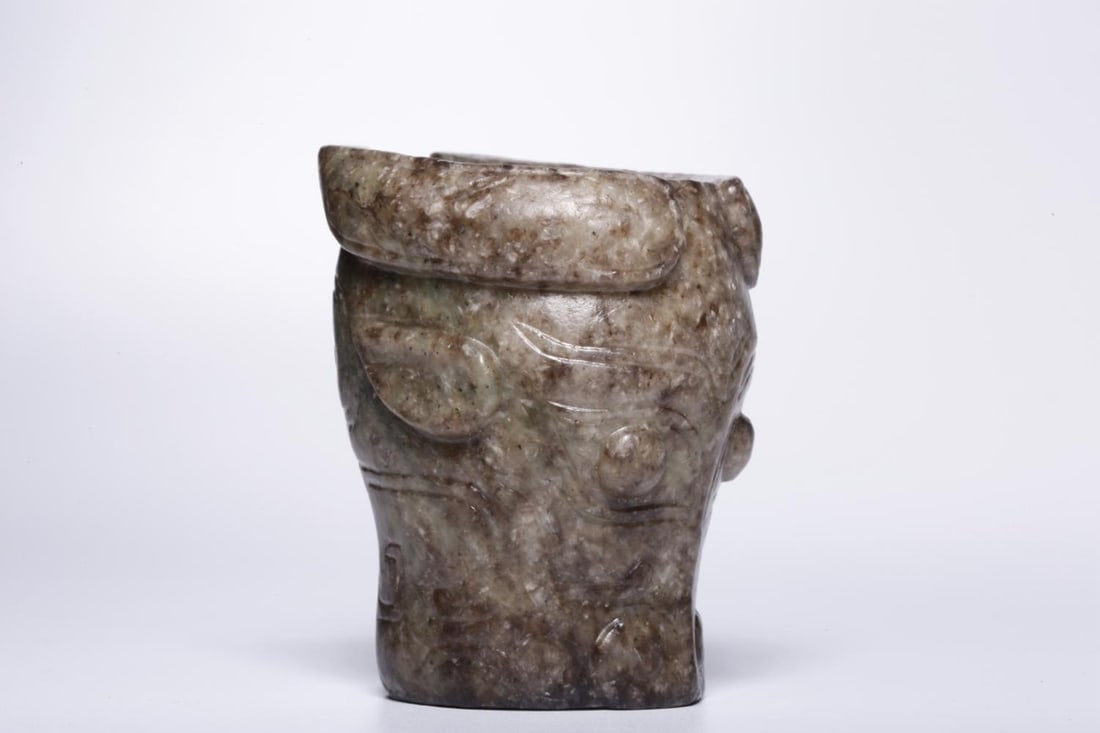 A Jade Figure Ring: A Jade Figure Ring. Height: 2.2" Diameter: 1.65" Weight: 0.2lbs.