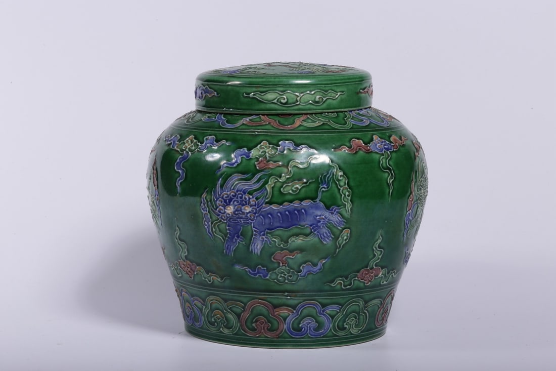 A Sancai Covered Jar: A Sancai Covered Jar. Height: 4.92" Diameter: 5.31" Weight: 0.95lbs.