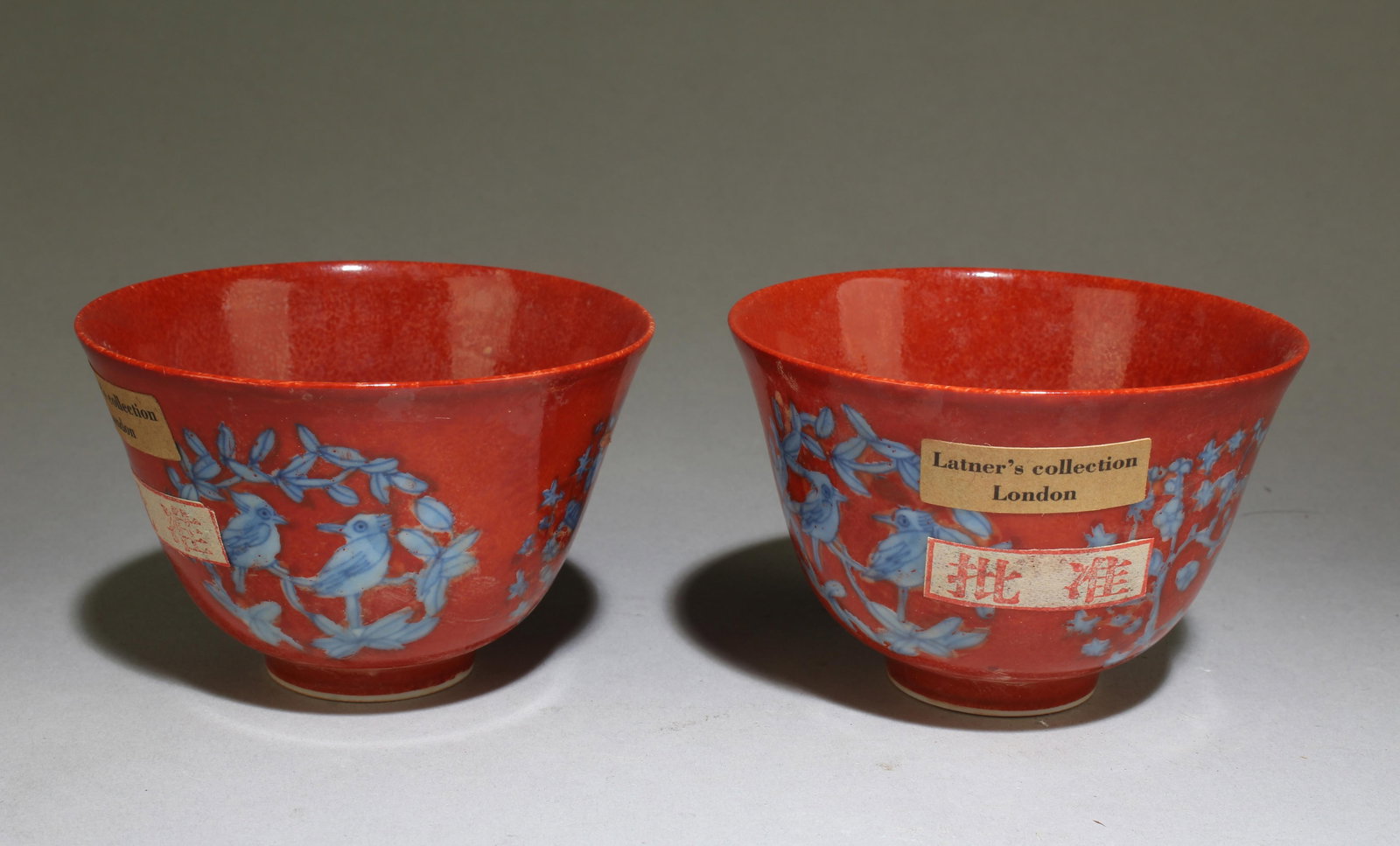 Pair of Blue and White Red Background Tea Cups: A Pair of Chinese Blue and White Red Background Tea Cups. Dimensions: 2.5" x 3.25".