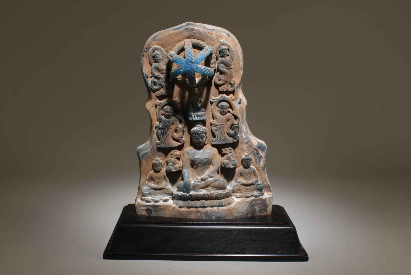 A Peking Glass Buddha Ornament with Stand: A Peking Glass Buddha Ornament with Stand. Dimension: 9" x 10.25" with stand.