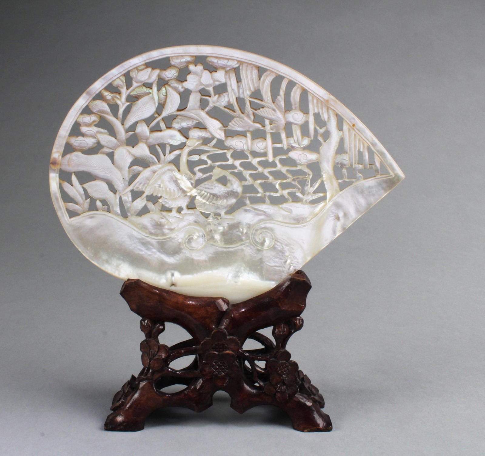 A Carved Mother-of- pearl Ornament: A Carved Mother-of- pearl Ornament. Comes fitted with a stand. Height: 7.9" (include stand)