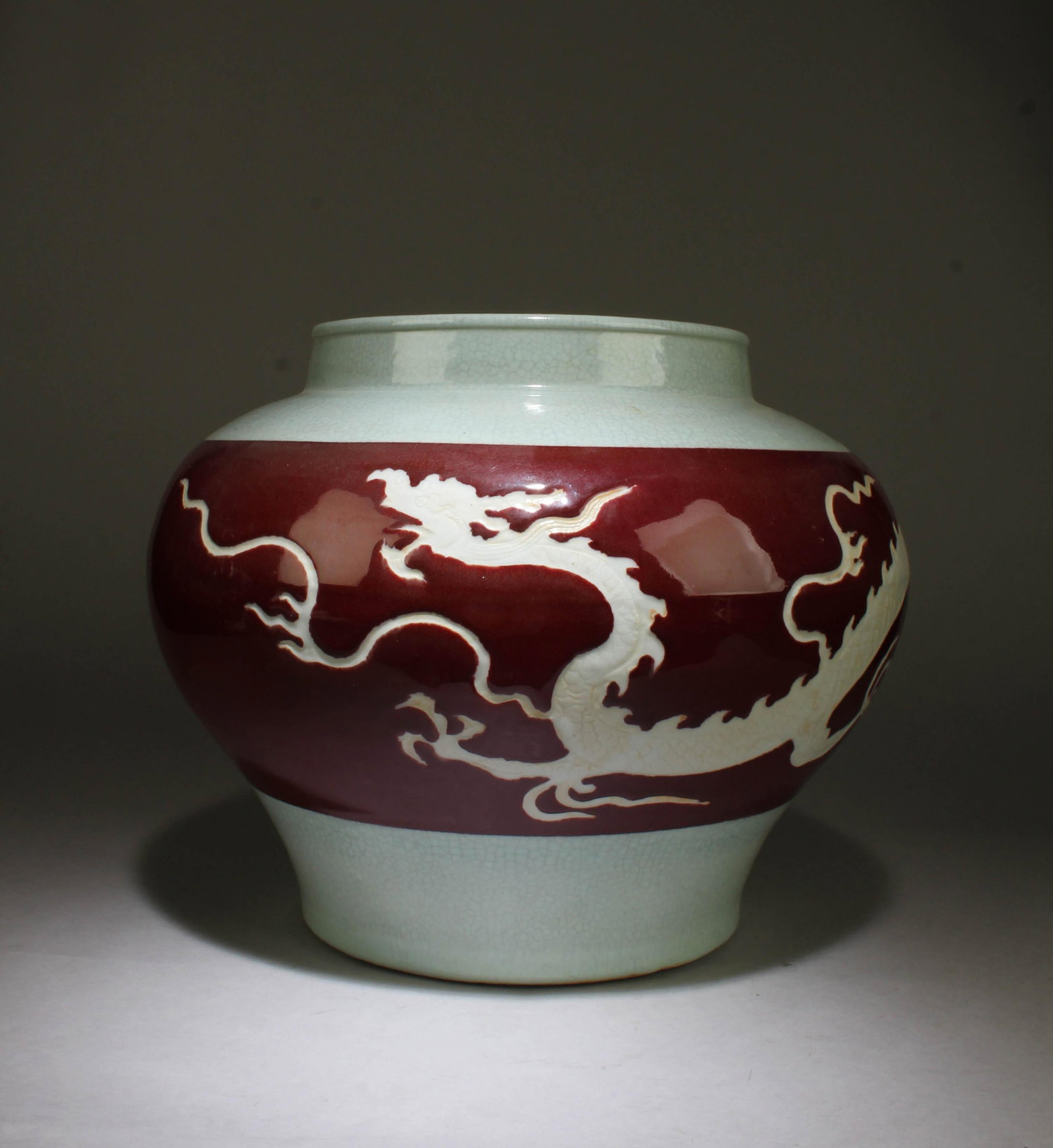 A Porcelain Jar: A Porcelain Jar. Height: 10.5" diameter: 12.5"