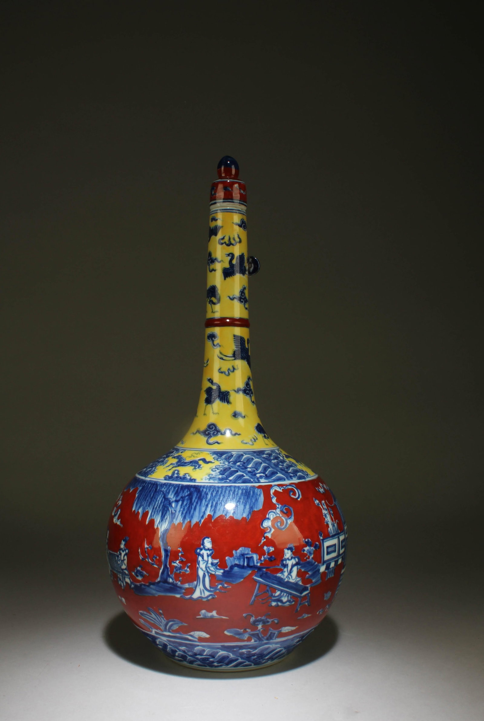 A Long Neck Polychrome Porcelain Vase: A Long Neck Polychrome Porcelain Vase with lid. Dimension: 16" x 7.5"