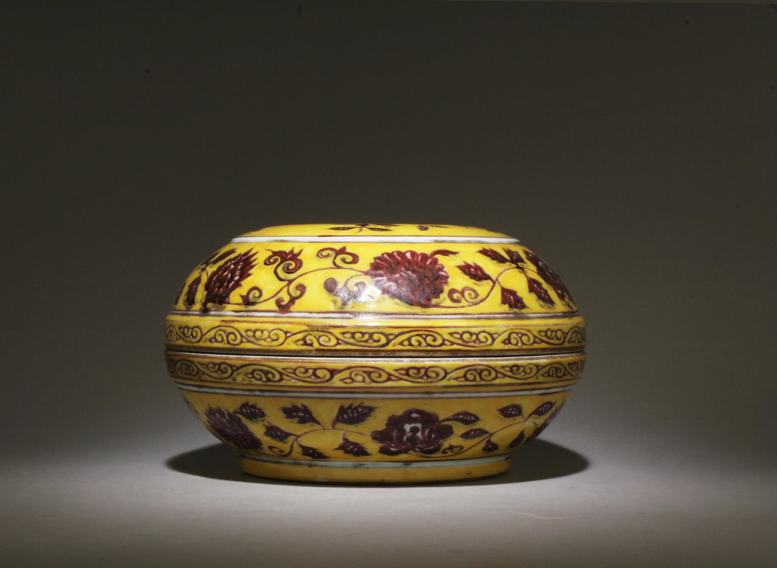 A Yellow and Red Container: A Yellow and Red Container. Dimensions: 8.75" x 5".