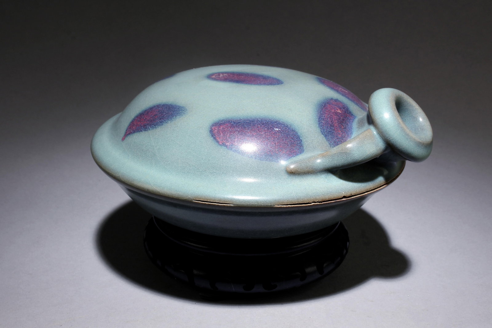 A Jun Ware Water Dropper: A Jun Ware Water Dropper.With stand. Dimensions: 4.25" x 7".