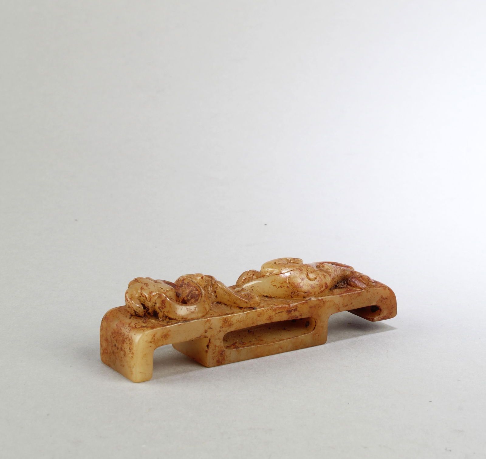 A Carved Jadestone Belt Hook: A Carved Jadestone Belt Hook. Length: 3.75"