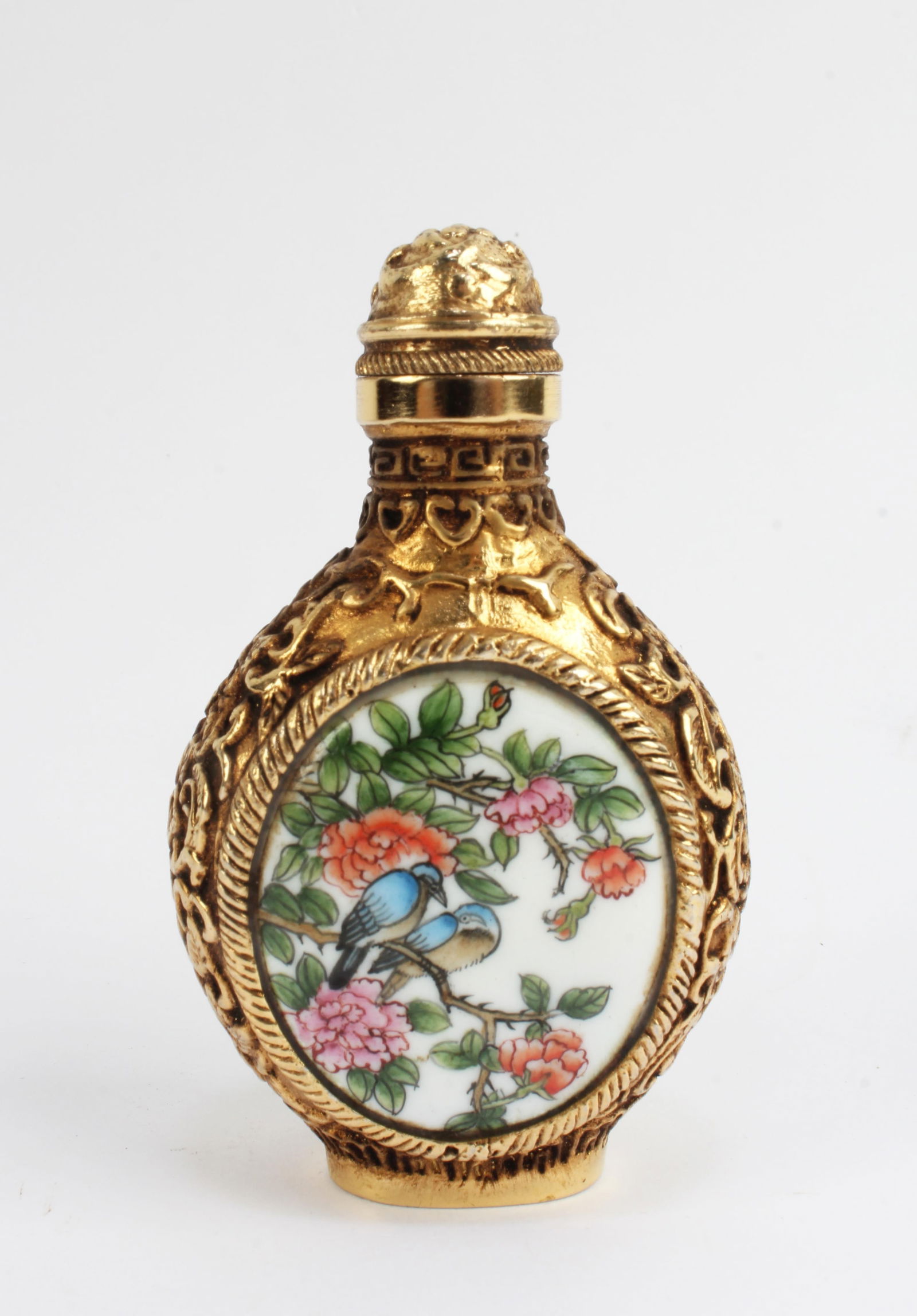 Gilt Bronze Enamel Flower Bird Snuff Bottle: Chinese Gilt Bronze Enamel Snuff Bottle. 'QianLong' mark at base. Height: 2.75"