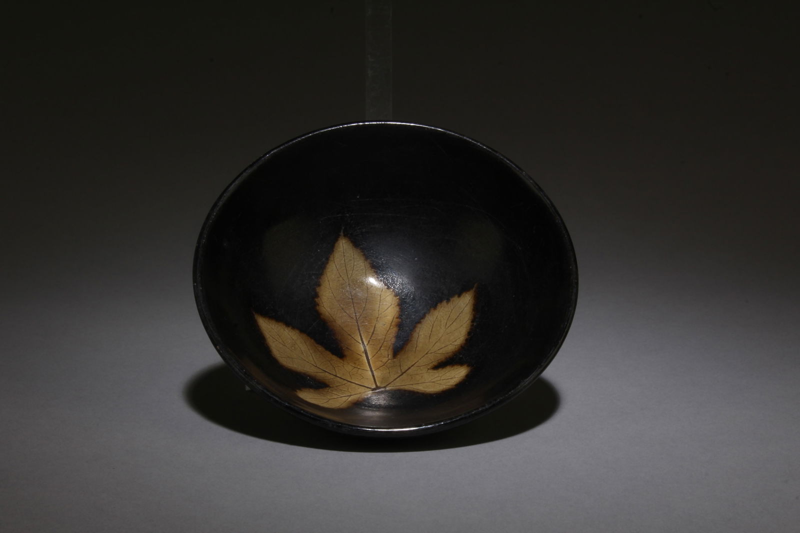 A Jianyao Tea Bowl: A Jianyao Tea Bowl. Dimensions: 4.5" x 1.5".