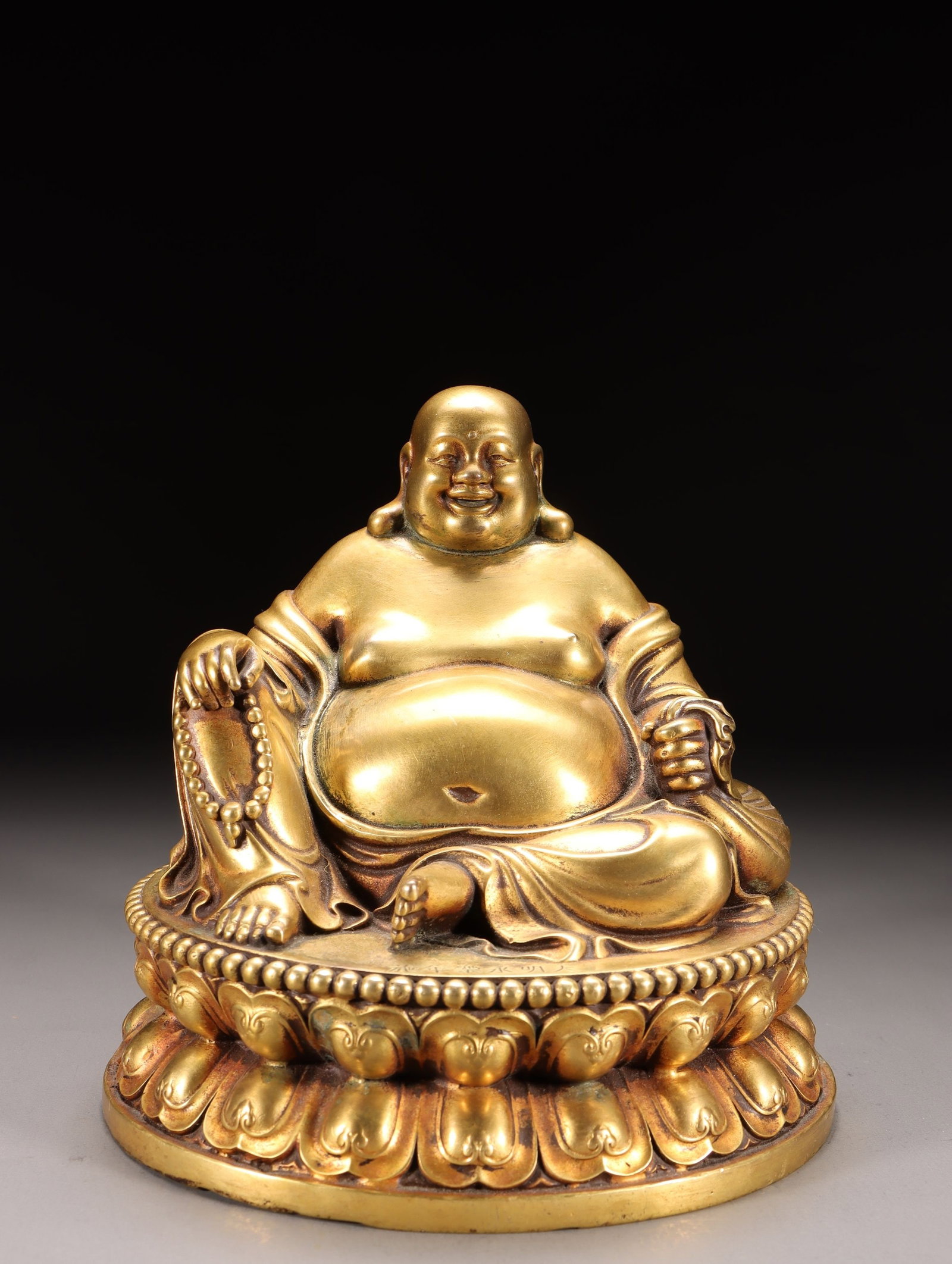 A Gilt Bronze Maitreya Statue: A Gilt Bronze Maitreya Statue. Dimensions: 5.91" x 5.98" x 5.63"; Weight: 7.61lbs.