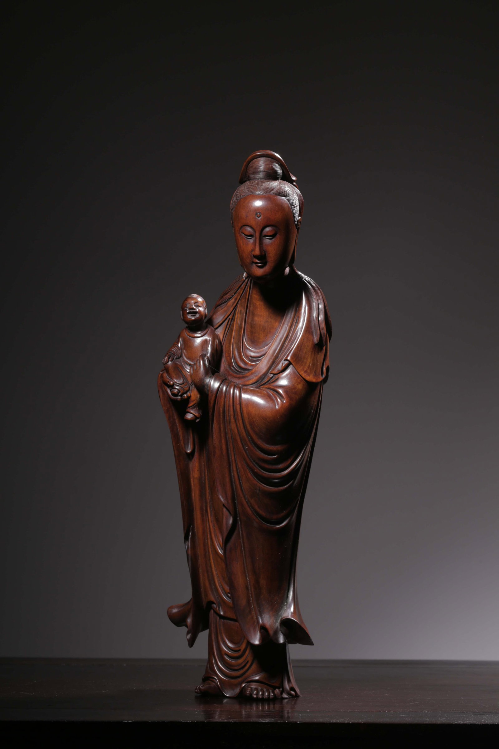 A Boxwood Guanyin Statue: A Boxwood Guanyin Statue. Dimensions: 13.58" x 4.06" x 2.56"; Weight: 2.29lbs.