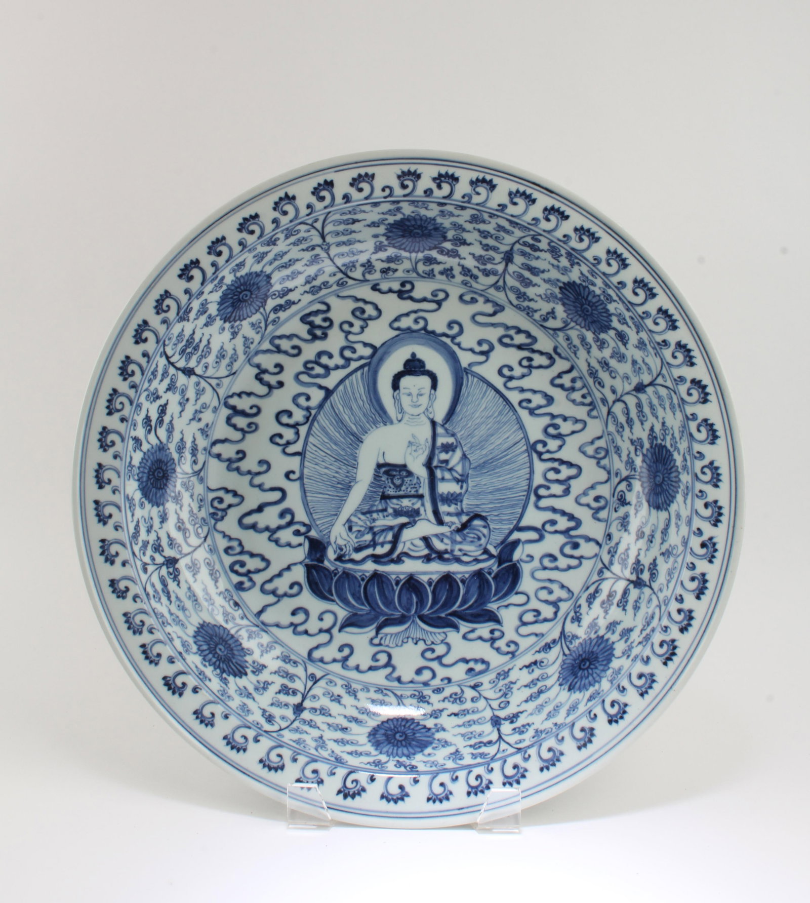 Chinese Blue & White Porcelain Charger: Chinese Blue & White Porcelain Charger, depicting a image of the Buddha seated on the lotus throne. A seven character mark is imprinted at the base. Diameter: 16.5"