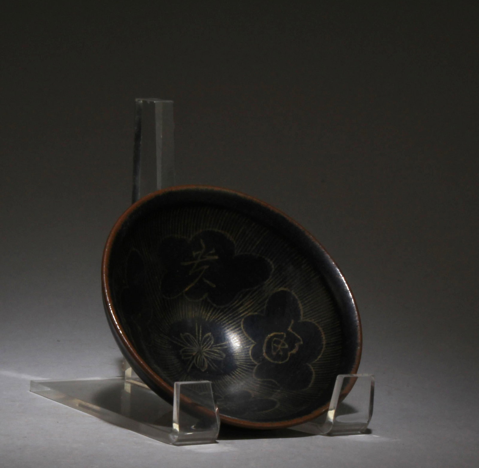 A Jianyao Teabowl: A Jianyao Teabowl. Dimensions: 2.25" x 4.5".