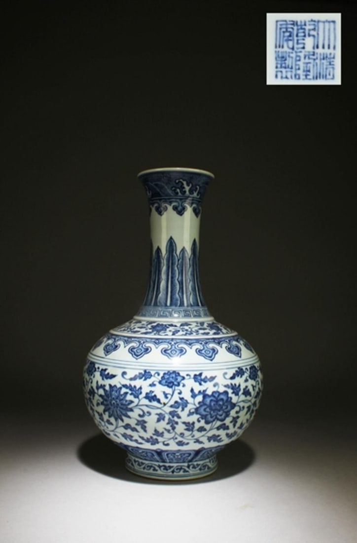 A Blue and White Vase: A Blue and White Vase. "QianLong" mark at base. Dimensions: 14.2" x 9"