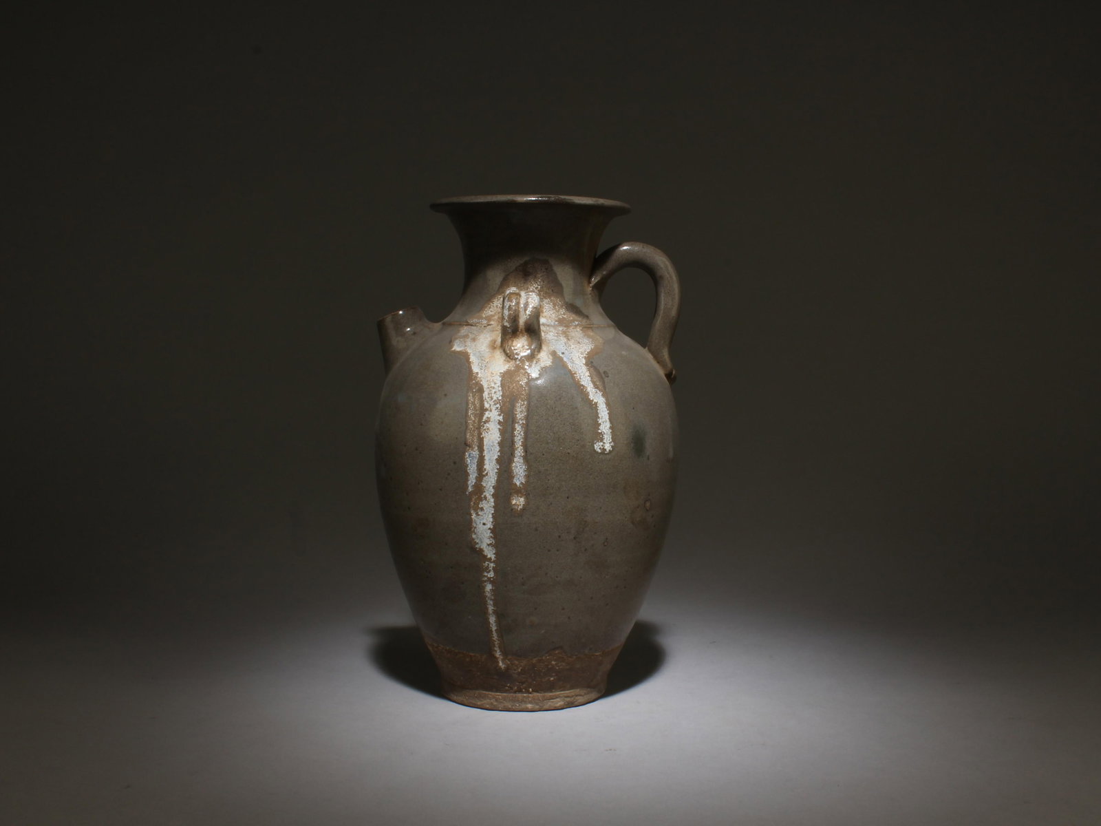 A Pottery Teapot: A Pottery Teapot. Dimensions: 10.25" x 6.5".