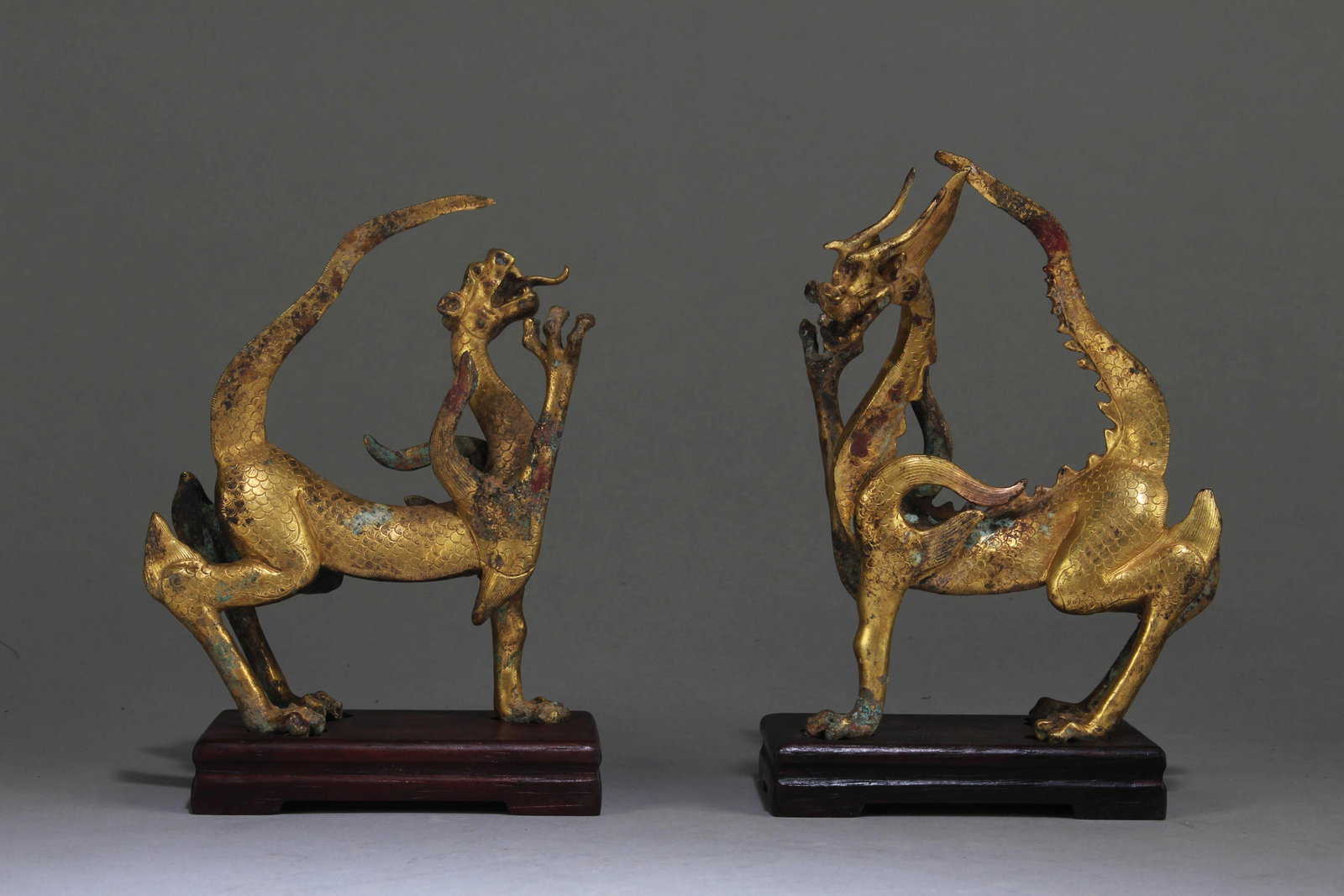 A Set of 2 Chinese Gilt Bronze Dragon: A Set of 2 Chinese Gilt Bronze Dragon. [1 of 2] Dimension: 5.25" x 3.75" x 2.75". [1 of 2] Dimension with Stand: 6" x 4.25" x 3". [2 of 2] Dimension: 4.75" x 4" x 2". [2 of 2]Dimension with 