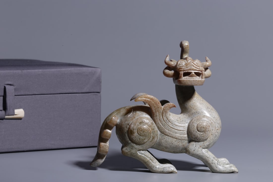 An Archaic Jade Tianlu Ornament: An Archaic Jade Tianlu Ornament. Height: 4.92in; Length: 5.12in; Width: 1.77in; Weight: 0.951lbs.